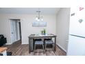 Charming dining area with a table and stools, complemented by modern decor, adjacent to the kitchen area at 2186 Spoleto Ln, North Charleston, SC 29406