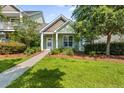 Beautiful home with a well-maintained lawn and inviting front porch at 2961 Sweetleaf Ln, Johns Island, SC 29455