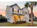 Charming two-story home with manicured lawn, attached garage and inviting curb appeal at 3018 Vincent Astor Dr, Johns Island, SC 29455