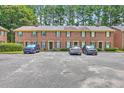 Spacious townhouse complex with ample parking surrounded by lush green trees at 302 Springview Ln # 7, Summerville, SC 29485