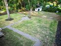 Spacious backyard featuring a cozy fire pit area and well-maintained lawn, ideal for relaxation at 3435 Hobson Dr, Johns Island, SC 29455