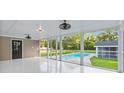 Relaxing screened patio with a view of the private swimming pool at 400 Black Oak Rd, Bonneau, SC 29431