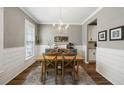 Elegant dining room with wood table, stylish chandelier, and decorative accents at 423 Sanctuary Park Dr, Summerville, SC 29486