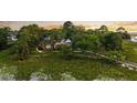 Aerial view displays waterfront property, marsh views, and a private dock at 510 Traders Aly, Mount Pleasant, SC 29464