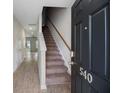 Inviting entryway with wood-look floors, staircase, and stylish front door at 540 Truman Dr, Goose Creek, SC 29445