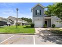 Charming townhome with attached garage and well-maintained lawn on a sunny day at 540 Truman Dr, Goose Creek, SC 29445