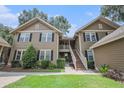 Inviting two-story condo with well-maintained landscaping and a beautiful exterior paint job at 8327 Childs Cove Cir, North Charleston, SC 29418