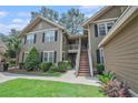 Inviting two-story condo with well-maintained landscaping and a beautiful exterior paint job at 8327 Childs Cove Cir, North Charleston, SC 29418