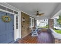 Cozy front porch with brick flooring, a ceiling fan, and comfortable seating, perfect for relaxing at 88 Smith St, Charleston, SC 29401