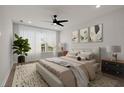 Comfortable main bedroom with a ceiling fan, natural light, and neutral decor at 123 Leeward Lndg, Summerville, SC 29486
