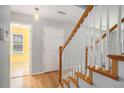 Inviting entryway with hardwood floors and a staircase leading to the upper level at 133 Guildford Dr, Goose Creek, SC 29445