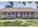 Inviting brick-paved front porch featuring a white picket fence and a welcoming 'Welcome' sign and decorative wreath at 138 Brant Acres Ln, Bonneau, SC 29431