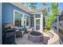 Cozy outdoor patio with fire pit and grill, perfect for entertaining guests at 1641 Adventure Xing, Mount Pleasant, SC 29466