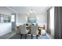 Formal dining room showcases elegant chandelier, wainscoting, and sophisticated decor for memorable gatherings at 1751 Cultivation Lane Dr # 498, Mount Pleasant, SC 29466