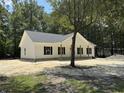 New construction with a welcoming exterior and a tree in the front yard at 216 Hill Dr, Summerville, SC 29483
