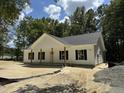 Inviting single-story home featuring a covered front porch with wooden support posts and dark shutters at 216 Hill Dr, Summerville, SC 29483