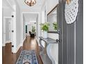 Welcoming entryway with hardwood floors and elegant decor at 217 Quimby Hill Dr, Huger, SC 29450