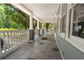 Spacious front porch with patterned tile flooring and white railing at 2170 Midland Park Rd, North Charleston, SC 29406