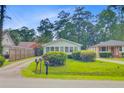Quaint home with neat landscaping and a charming facade, set in a peaceful neighborhood at 316 Simmons Ave, Summerville, SC 29483