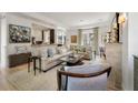 An expansive living room featuring a large sectional sofa and stone fireplace at 32 Prioleau St # J, Charleston, SC 29401