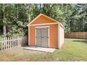 Storage shed in fenced back yard, offering extra space for tools and outdoor equipment at 350 Cypress Walk Way, Wando, SC 29492
