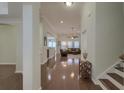 Open floor plan and gleaming hardwood floors create a warm, inviting ambiance at 5011 W Liberty Meadows Dr, Summerville, SC 29485