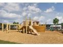 Community playground featuring a wooden ship play structure and swings for enjoyment at 5302 Bending Flats Way, Summerville, SC 29485