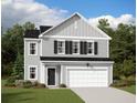 Charming two-story home with a manicured lawn, attached garage, and traditional black shutters at 5313 Bending Flats Way, Summerville, SC 29485