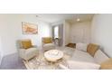 Cozy living room with neutral tones, stylish decor, an accent rug, and ample seating near a bright window at 5313 Bending Flats Way, Summerville, SC 29485