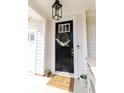 Inviting front door adorned with a decorative wreath, enhancing the home's curb appeal at 558 Pendleton Dr, Moncks Corner, SC 29461