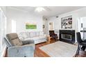 Cozy living room with a fireplace, hardwood floors, and comfortable seating at 700 Daniel Ellis Dr # 4107, Charleston, SC 29412