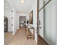 Bright entryway with a wood console table, modern decor, and light wood floors at 729 Maynard Ln, Summerville, SC 29486
