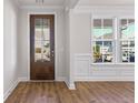 Inviting entryway featuring a wood door with glass and beautiful hardwood floors at 770 Maynard Ln, Summerville, SC 29486