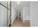 Bright foyer with light wood floors, white walls, and glass paneled front door at 778 Maynard Ln, Summerville, SC 29486