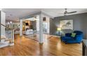 Open-concept living area featuring hardwood floors, modern furnishings, and ample natural light at 1033 Mathis Ferry Rd, Mount Pleasant, SC 29464