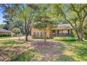 Traditional brick home with a cozy front porch and mature trees at 105 Greendale Ct, Summerville, SC 29485