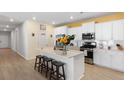 Bright kitchen featuring stainless steel appliances and a quartz island with seating at 1136 Kane Blue, Summerville, SC 29485