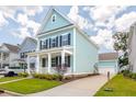 Inviting two-story home with a spacious driveway and well-maintained yard at 1150 Oak Bluff Ave, Charleston, SC 29492