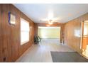 Spacious living room featuring paneled walls and wood laminate flooring at 1203 Hawthorne Rd, Hanahan, SC 29410