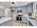 Bright kitchen featuring gray cabinets, stainless steel appliances, and ample counter space at 1393 Secessionville Rd, Charleston, SC 29412