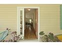 Inviting entryway offering a glimpse into the home's open layout and hardwood floors at 1493 Little Rock Blvd, Charleston, SC 29412