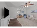 Cozy living room with hardwood floors, a ceiling fan and an open floor plan to the dining area at 1514 Stanwick Dr, Johns Island, SC 29455