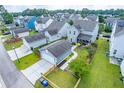 Aerial view of a home with detached garage and fenced backyard at 1726 Winfield Way, Charleston, SC 29414