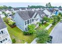 Charming two-story home with a double porch and well-kept lawn at 1726 Winfield Way, Charleston, SC 29414