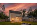 Spacious backyard featuring a screened porch and outdoor seating area, perfect for relaxation at 1989 Nitsa St, Johns Island, SC 29455