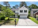 Beautiful two-story home with well-maintained landscaping and a spacious driveway at 207 Breckingridge Dr, Ladson, SC 29456
