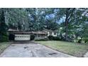 Home exterior featuring an attached garage and a large driveway at 321 Fairington Dr, Summerville, SC 29485