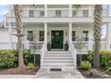 Close-up of the home's front entrance, highlighting the elegant door, porch, and manicured landscaping at 3224 Hatchway Dr, Mount Pleasant, SC 29466