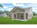 The back exterior shows a covered patio and an ample yard at 403 Cadbury Loop, Summerville, SC 29486