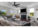 Comfortable living room with a fireplace, a large sectional sofa, and plenty of natural light at 4419 Louisa Lane Ln, North Charleston, SC 29405